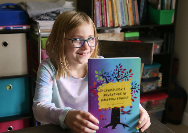 girl holding a book
