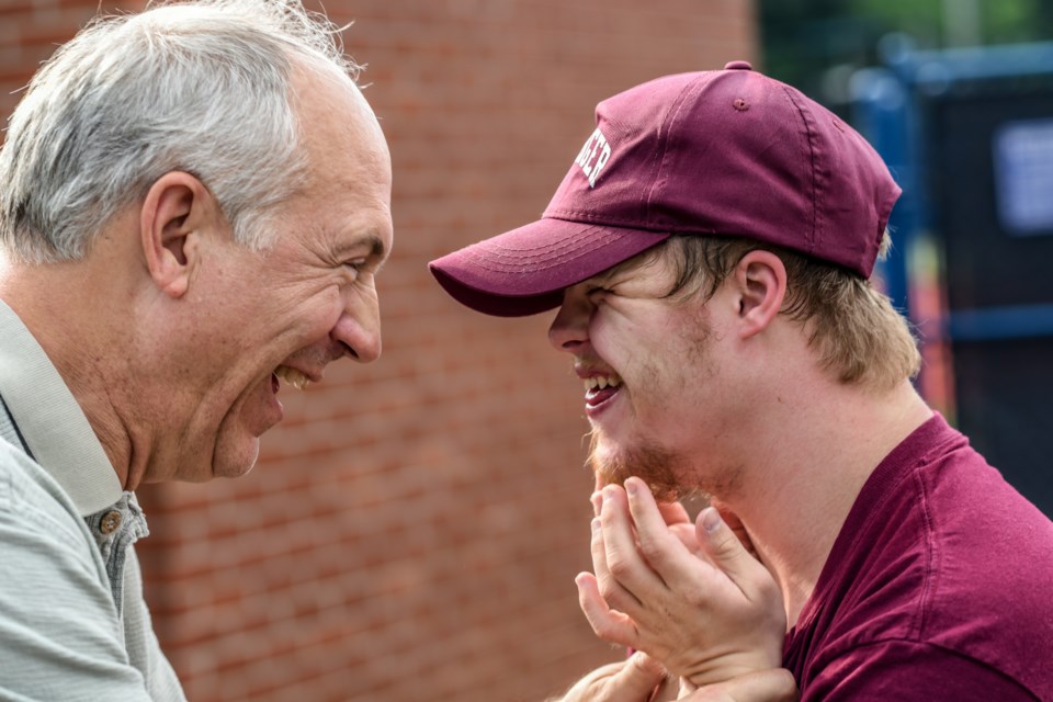 dad and son laughing 
