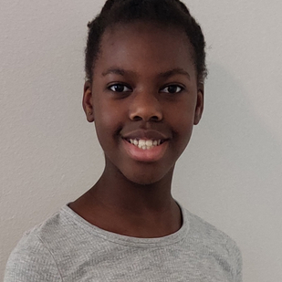 Sisters Kesinu (pictured) and Ayiba Ehimika took first place in their grade level spelling bees. (Photo: Business Wire)
