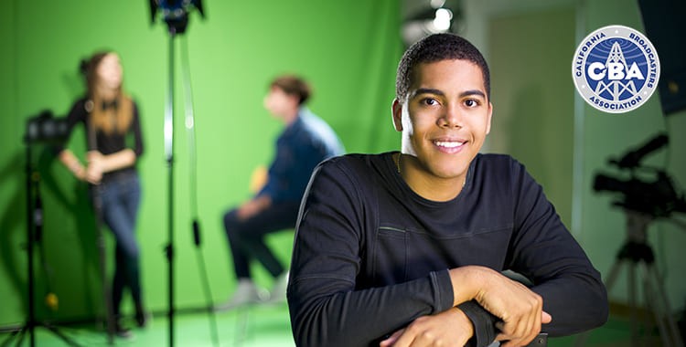 Student smiling at the camera